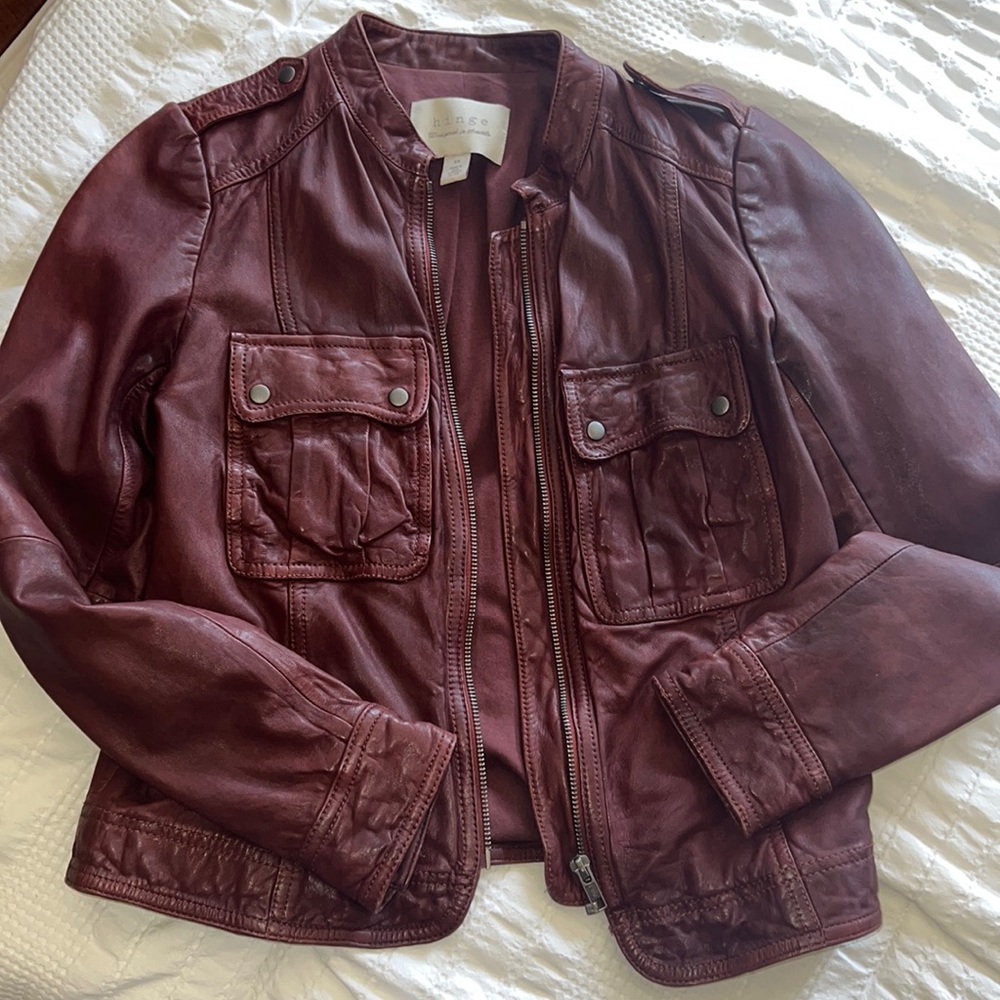 Used in great condition, leather jacket, and burgundy/brown color
